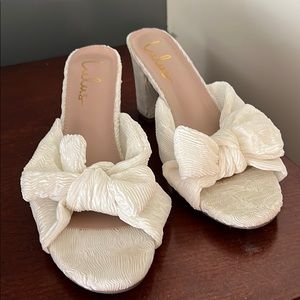 White Lulus Dolce Vita inspired ruffle heels